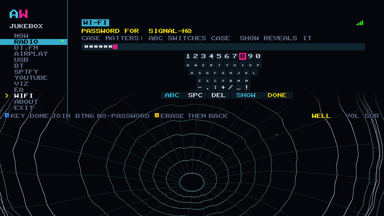 The arcade keyboard on the cabinet asking for a Wi-Fi password, with masked characters and a SHOW key
