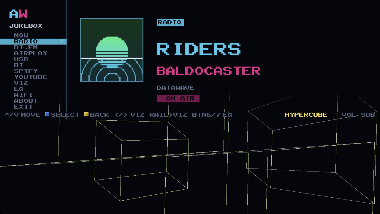 The AWOW Jukebox NOW screen on a cabinet: a synthwave station on air over the HYPERCUBE visualizer, a four-dimensional cube turning inside out on the beat